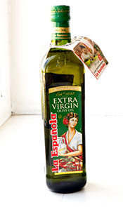 Botella verde oscuro de aceite de oliva virgen extra.