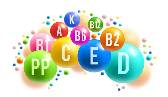 Nombres de vitaminas y minerales en burbujas de colores.